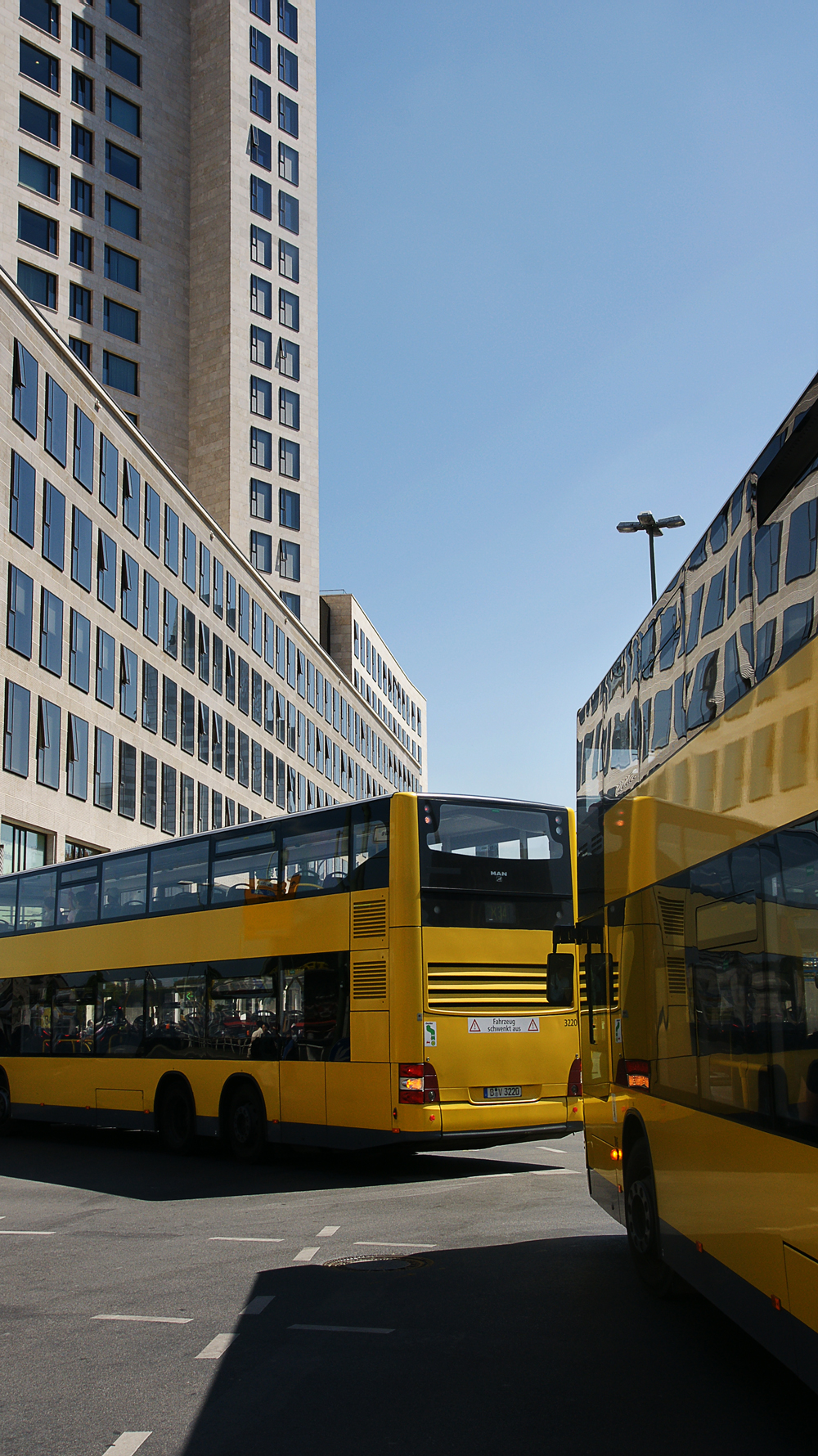 berlin waldorf astoria and yellow busses